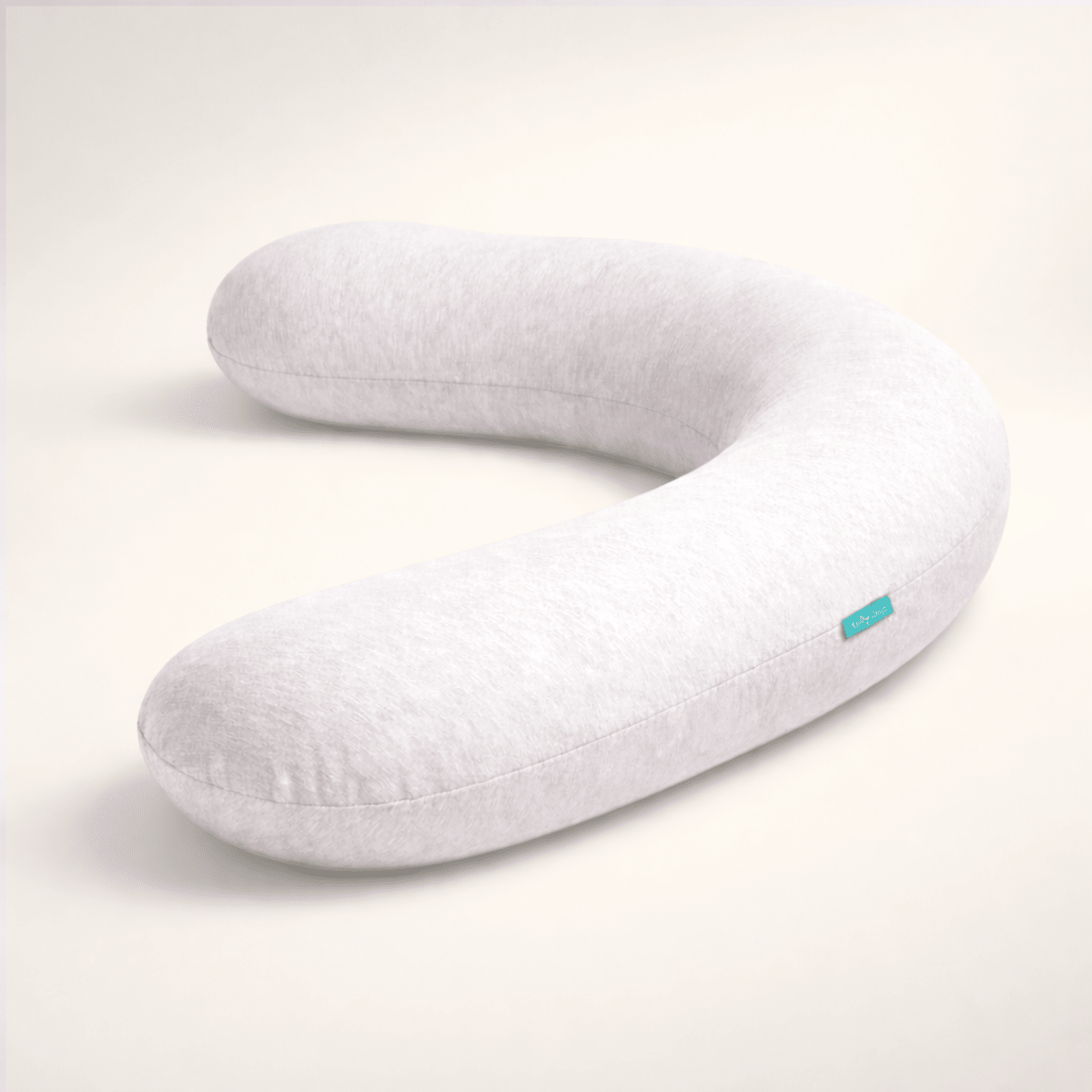 Full-length body support pillow designed for pregnancy comfort and spinal alignment