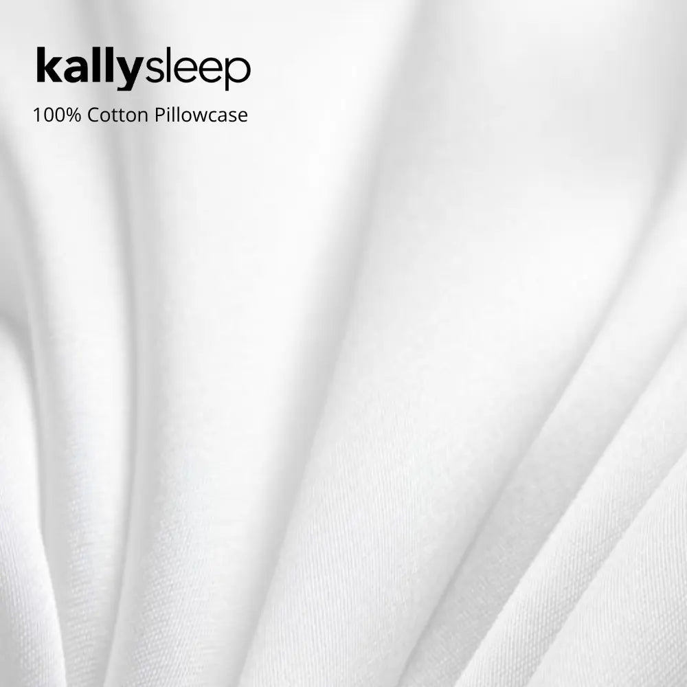 White 100% cotton pillowcase with soft folds and smooth texture close-up