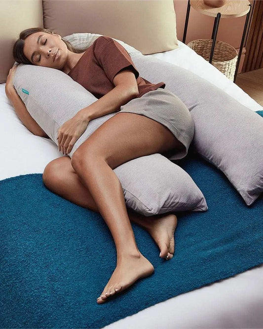 U-shaped pregnancy pillow providing full body support and comfort for maternity and nursing use