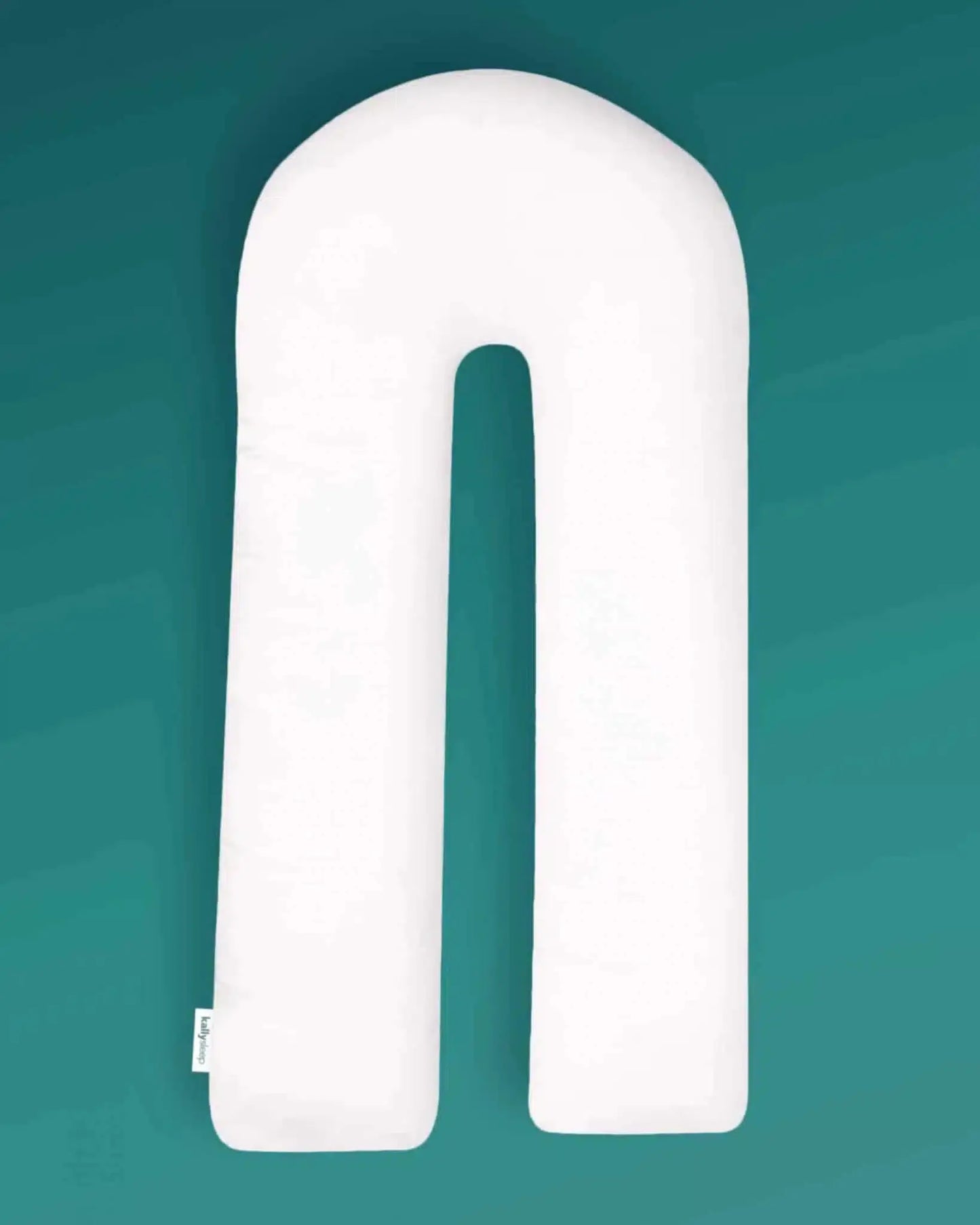 U-shaped ergonomic white body pillow on teal background for posture support and sleep