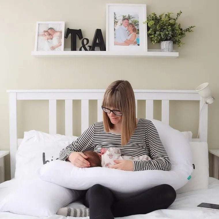 U-shaped pregnancy pillow providing full body support and comfort for maternity and postpartum use