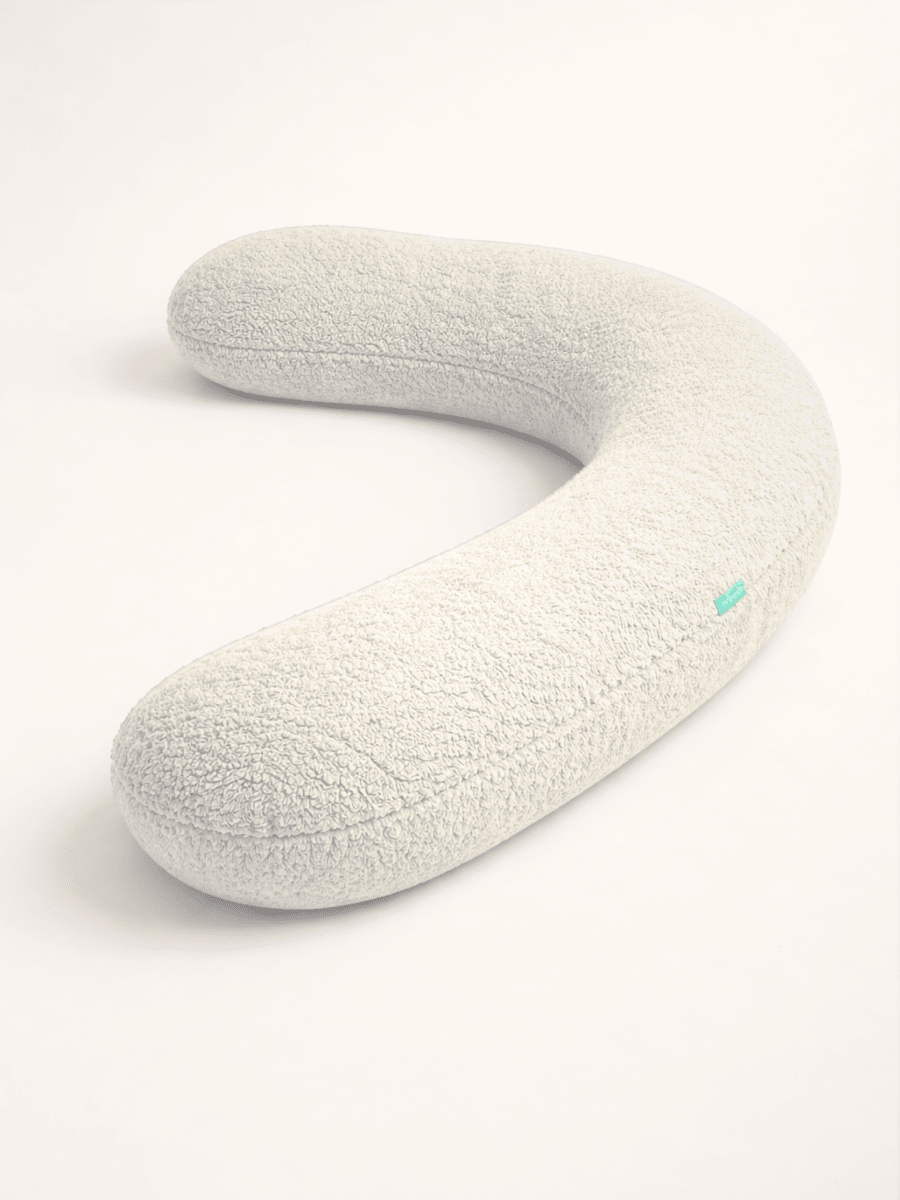 Full-length body support pillow designed for pregnancy comfort and improved sleep quality