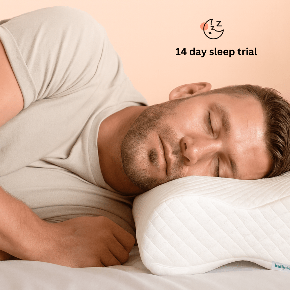Man sleeping on a pillow with a '14 day sleep trial' offer displayed above.